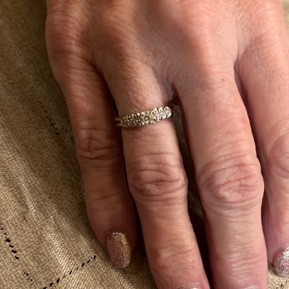 Solitaire with a ring guard. Could be used as a promise ring or right hand ring